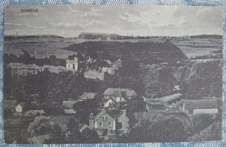 View of the Dobele Castle ruins, bridge, and Grand Street 1997(*) Dobele 13x8 cm postcard Latvia  