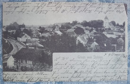 View of Dobele from the castle ruins before the church's final reconstruction, 1997(*) Dobele 13x8 cm postcard, Latvia  