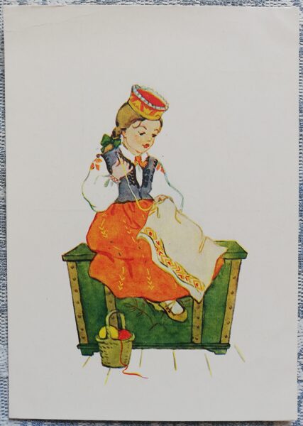 A girl is sitting on a chest in a Latvian national costume. 1957 postcard 10.5x15 cm Artist K. Dale