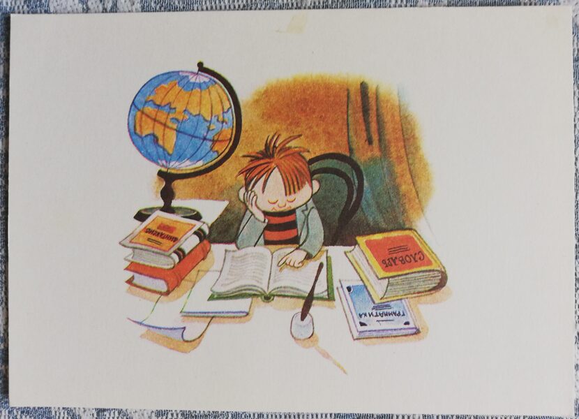 Children's postcard of the USSR "A schoolboy at a desk with a globe" 1978 15x10.5 cm Soviet artist
